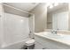Bathroom features tub and shower combo, and a vanity with great lighting at 6687 Hill Creek Cv, Lithonia, GA 30058