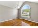 Bedroom featuring hardwood floors and a vaulted ceiling at 6687 Hill Creek Cv, Lithonia, GA 30058