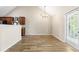 Charming dining room with wood-look floors and sliding door to backyard at 6687 Hill Creek Cv, Lithonia, GA 30058