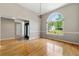 Open-concept dining area with hardwood floors and natural light at 6687 Hill Creek Cv, Lithonia, GA 30058