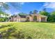 Suburban home showcasing manicured lawn and inviting curb appeal at 6687 Hill Creek Cv, Lithonia, GA 30058