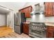 Modern kitchen with stainless steel appliances, gas range, and ample cabinet space at 6687 Hill Creek Cv, Lithonia, GA 30058