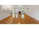 Spacious living room features vaulted ceilings, fireplace, and gleaming hardwood floors at 6687 Hill Creek Cv, Lithonia, GA 30058