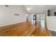 Bright and airy living room with vaulted ceiling, hardwood floors, and ample natural light at 6687 Hill Creek Cv, Lithonia, GA 30058