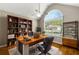Bright home office with built-in bookshelves and a large window at 6687 Hill Creek Cv, Lithonia, GA 30058