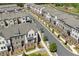 Townhome community showing meticulously landscaped streets, manicured lawns and beautiful home exteriors at 243 Commons Ave, Woodstock, GA 30188