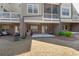 Inviting backyard featuring a patio, lush lawn, and mature shrubs for relaxation and enjoyment at 243 Commons Ave, Woodstock, GA 30188