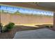 Spacious backyard with a retaining wall and patio, perfect for outdoor entertaining at 243 Commons Ave, Woodstock, GA 30188