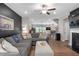 Spacious living room showcasing the open floor plan, modern decor, and a cozy fireplace at 243 Commons Ave, Woodstock, GA 30188