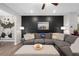 Inviting living room featuring stylish decor, comfortable seating, and ample natural light at 243 Commons Ave, Woodstock, GA 30188