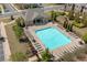 Aerial view of a community pool with lounge chairs and umbrellas at 243 Commons Ave, Woodstock, GA 30188