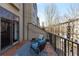 Relaxing balcony featuring comfortable seating and string lights overlooking the neighborhood and providing an urban oasis at 3475 Oak Valley Rd # 130, Atlanta, GA 30326
