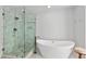Elegant bathroom featuring marble shower, a free-standing tub, and sleek fixtures at 3475 Oak Valley Rd # 130, Atlanta, GA 30326