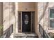 Charming black front door with decorative glass panels, enhanced by elegant sidelights and hardware at 3475 Oak Valley Rd # 130, Atlanta, GA 30326