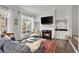Cozy living room with a fireplace, built-in cabinets, and comfortable seating at 3475 Oak Valley Rd # 130, Atlanta, GA 30326