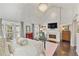 Spacious main bedroom with a fireplace, two windows, and comfortable furnishings at 3475 Oak Valley Rd # 130, Atlanta, GA 30326