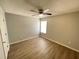 Bedroom featuring hardwood floors, neutral wall color, and ceiling fan at 4884 Browns Mill Ferry Rd, Lithonia, GA 30038