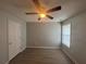 Bedroom featuring hardwood floors, neutral wall color, and ceiling fan at 4884 Browns Mill Ferry Rd, Lithonia, GA 30038