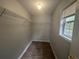 Walk-in closet with vinyl floors and wire shelving at 4884 Browns Mill Ferry Rd, Lithonia, GA 30038
