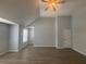 Open-plan living room featuring a ceiling fan and light hardwood flooring at 4884 Browns Mill Ferry Rd, Lithonia, GA 30038