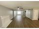 Spacious living room with laminate floors, neutral paint, and a fireplace at 4884 Browns Mill Ferry Rd, Lithonia, GA 30038