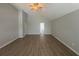 Open-plan living room featuring a ceiling fan and light hardwood flooring at 4884 Browns Mill Ferry Rd, Lithonia, GA 30038