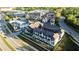 Aerial view of modern townhouses in a neatly planned community with tree-lined streets and easy highway access at 6666 Sterling Dr, Sandy Springs, GA 30328