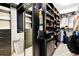 Spacious walk-in closet with ample shelving and storage, perfect for organizing clothes and accessories at 6666 Sterling Dr, Sandy Springs, GA 30328