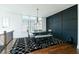 Dining room with dark wood table, stylish rug, and ample natural light at 6666 Sterling Dr, Sandy Springs, GA 30328