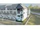 A stylish, modern townhouse with clean lines and a balcony offering street views at 6666 Sterling Dr, Sandy Springs, GA 30328