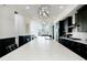 A bright kitchen features a long island, stainless steel appliances, and stylish pendant lighting at 6666 Sterling Dr, Sandy Springs, GA 30328