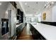 Spacious kitchen with stainless steel appliances, granite countertops, and a view to the living room at 6666 Sterling Dr, Sandy Springs, GA 30328