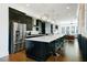 Modern kitchen with stainless steel appliances, a large island, and open layout at 6666 Sterling Dr, Sandy Springs, GA 30328