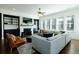 Cozy living room with fireplace, tv, built-ins, and plenty of seating at 6666 Sterling Dr, Sandy Springs, GA 30328