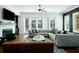 Bright living room featuring a fireplace, tv, and modern furnishings at 6666 Sterling Dr, Sandy Springs, GA 30328