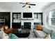 Modern living room with fireplace, tv, and comfortable seating at 6666 Sterling Dr, Sandy Springs, GA 30328