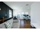 Bright living room with hardwood floors and stylish gray couch and dark blue accent wall at 6666 Sterling Dr, Sandy Springs, GA 30328
