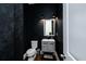 Stylish half bathroom with textured wallpaper and modern fixtures at 6666 Sterling Dr, Sandy Springs, GA 30328