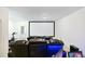 Basement theater room featuring reclining leather seating and a large projection screen at 6666 Sterling Dr, Sandy Springs, GA 30328