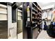 Well-organized walk-in closet with ample shelving, drawers, and hanging space at 6666 Sterling Dr, Sandy Springs, GA 30328