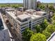 Aerial view of the building showcasing the community pool, balconies, and nearby green spaces at 805 Peachtree Ne St # 220, Atlanta, GA 30308
