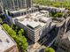 Aerial view of the property showcasing the rooftop, surrounding cityscape, and manicured greenery at 805 Peachtree Ne St # 220, Atlanta, GA 30308