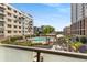 Stunning balcony view overlooking the community pool and surrounding neighborhood with lush landscaping at 805 Peachtree Ne St # 220, Atlanta, GA 30308