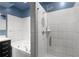 Sleek bathroom featuring a tiled shower and separate soaking tub at 805 Peachtree Ne St # 220, Atlanta, GA 30308