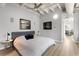Cozy bedroom featuring a plush bed, stylish decor, and access to an en-suite bathroom with a soaking tub at 805 Peachtree Ne St # 220, Atlanta, GA 30308