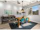 Dining room with hardwood floors, modern lighting, and ample sunlight at 805 Peachtree Ne St # 220, Atlanta, GA 30308