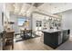 Modern kitchen with stainless steel appliances and island with breakfast bar at 805 Peachtree Ne St # 220, Atlanta, GA 30308