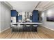 Spacious kitchen with modern appliances, island with stools, and hardwood floors at 805 Peachtree Ne St # 220, Atlanta, GA 30308