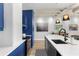 Modern kitchen with white countertops, stainless steel appliances, and a breakfast bar at 805 Peachtree Ne St # 220, Atlanta, GA 30308