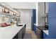 Modern kitchen with stainless steel appliances, open to living area, and hardwood floors at 805 Peachtree Ne St # 220, Atlanta, GA 30308